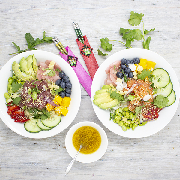 Poke bowls drizzled with orange and ginger vinaigrette