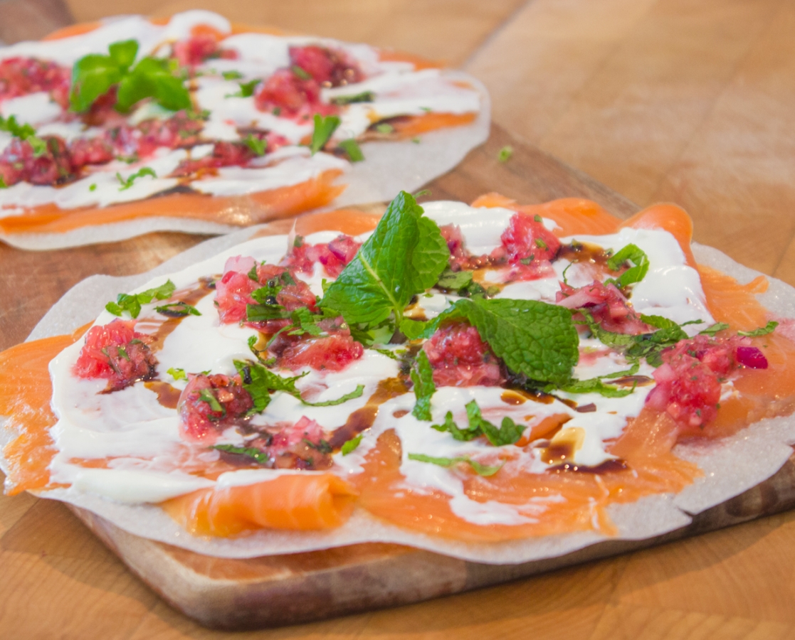 Smoked salmon carpaccio on crispy rice paper with blood orange salsa