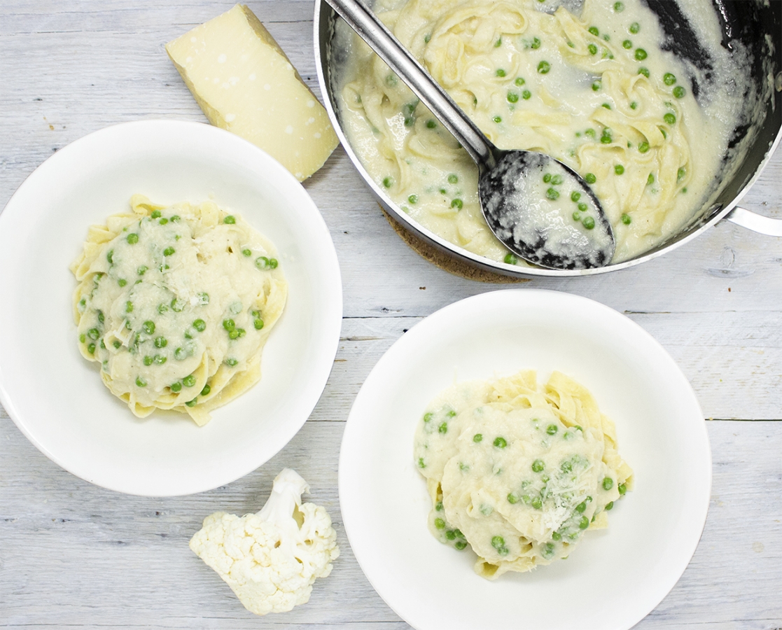 Fettuccini in a cauliflower Alfredo sauce and green peas