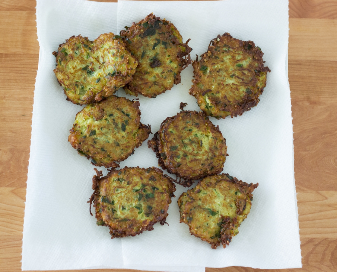 Spaghetti squash, quinoa, spinach and parmesan fritters topped with basil sour cream