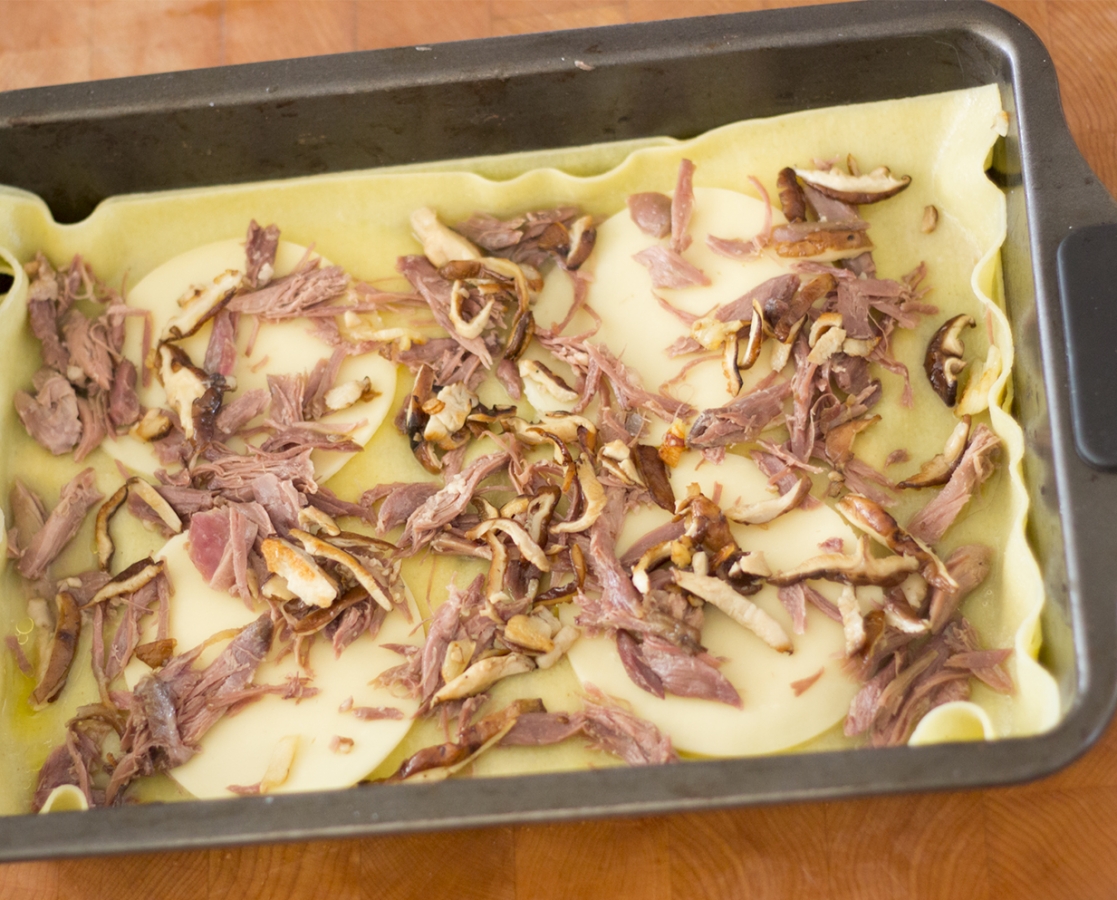 Duck confit and shiitake mushroom lasagna with a creamy white wine fresh sage sauce