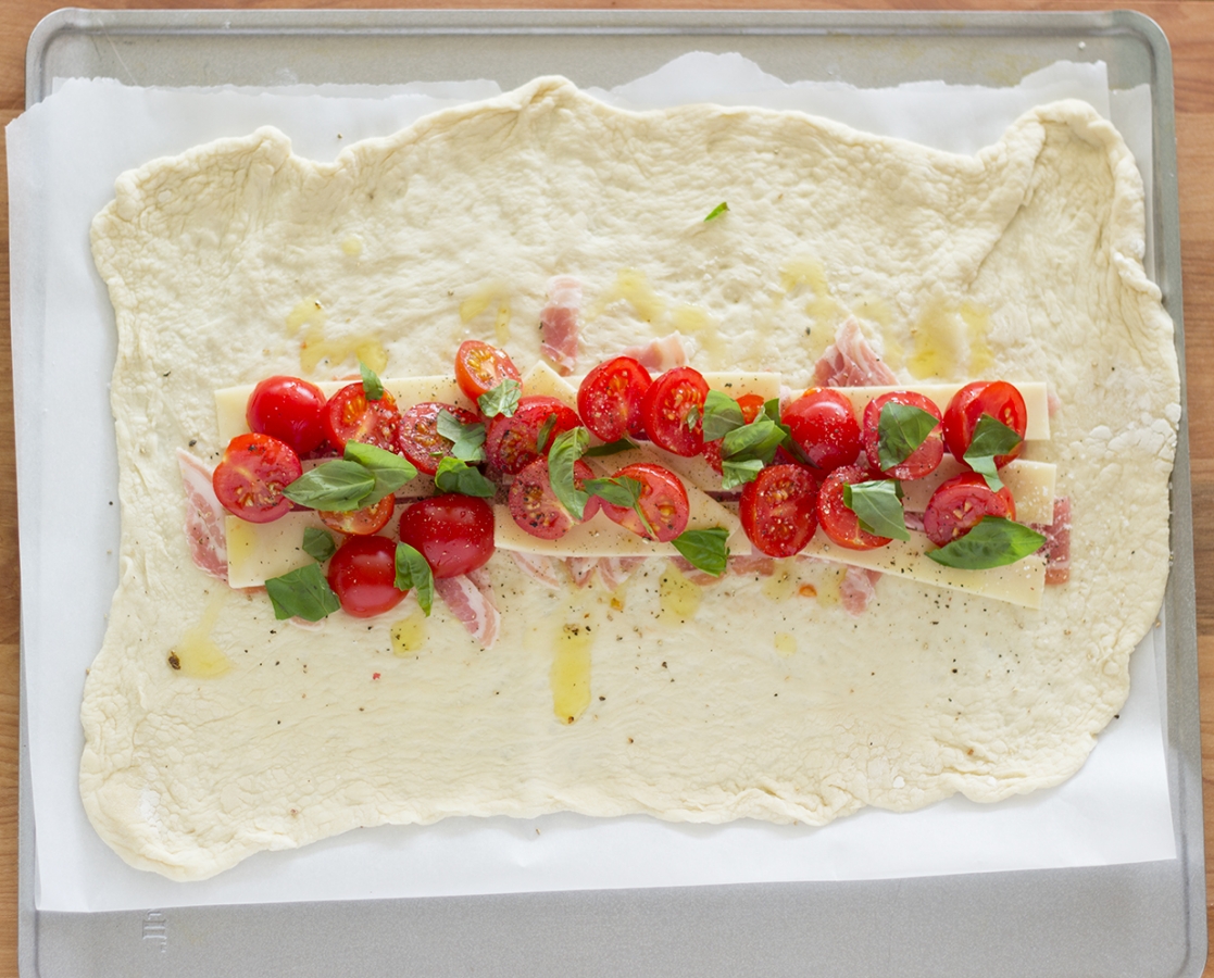 Cherry tomato-pancetta calzone with Balsamumm drizzle