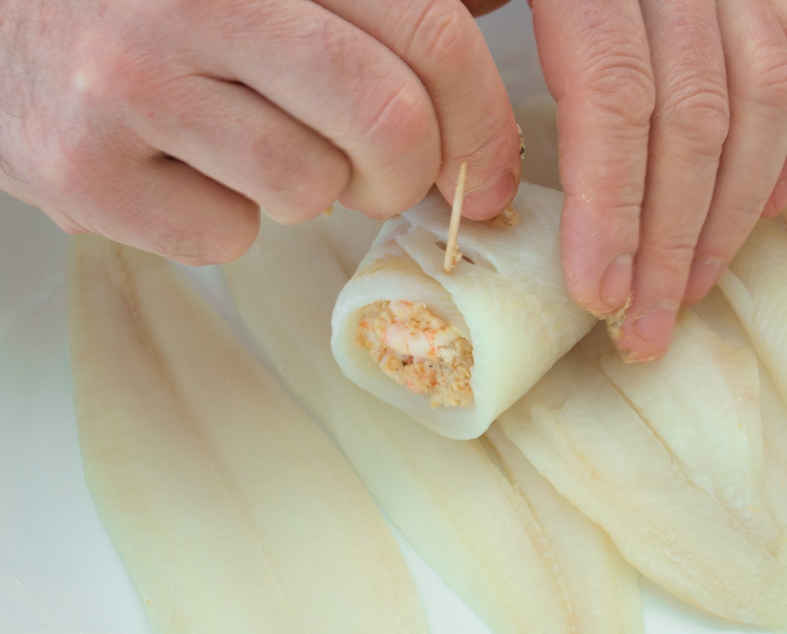 Shrimp stuffed sole fillet rolls