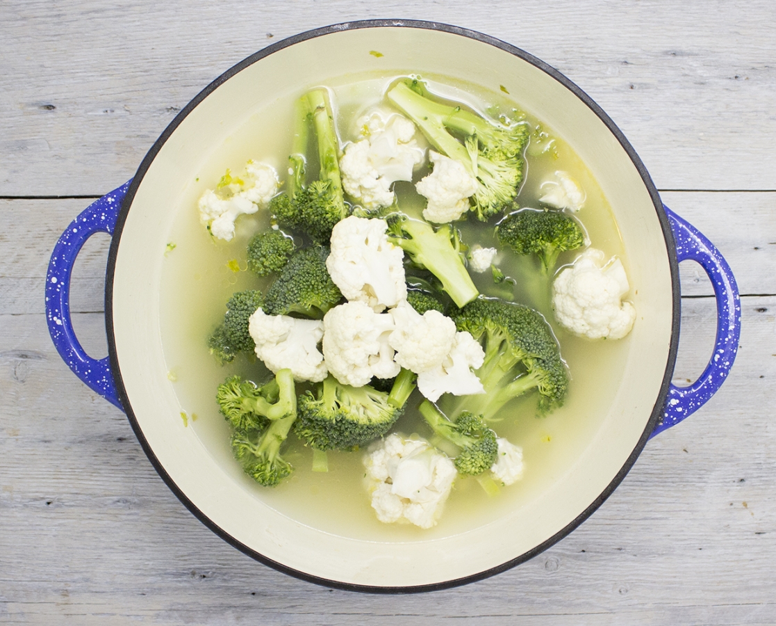 Cauliflower, broccoli & fresh mint soup topped with ricotta cheese