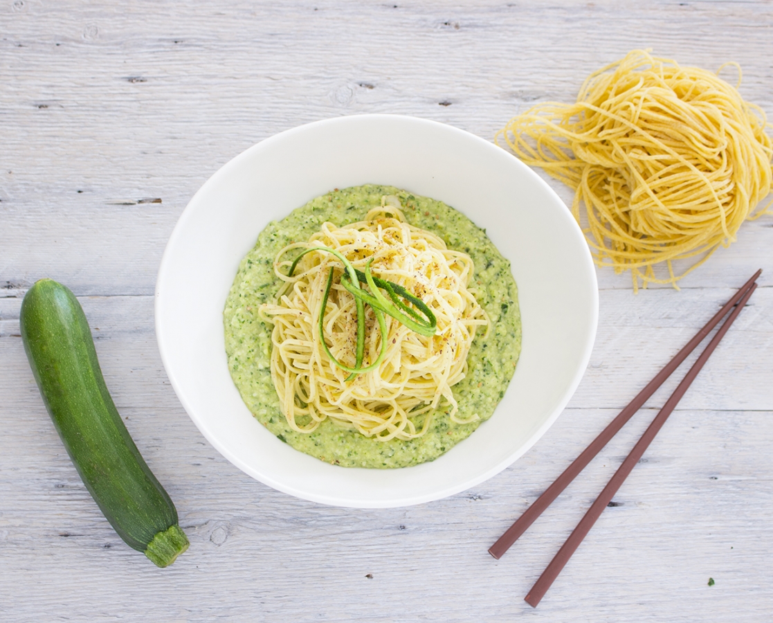 Spaghetti on zucchini, basil and almond pesto