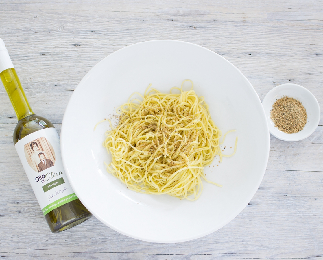 Spaghetti on zucchini, basil and almond pesto