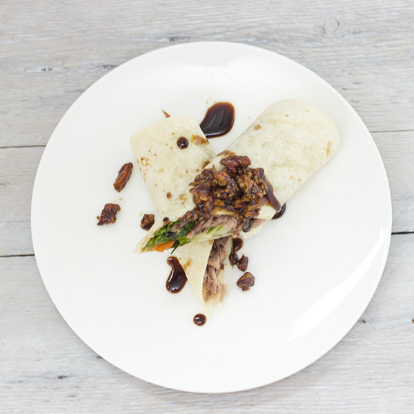 Duck confit crêpes with caramelized Balsamumm Pecan butter sauce