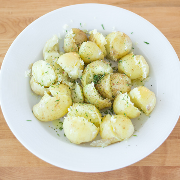 Boiled potatoes with olive oil and fresh rosemary