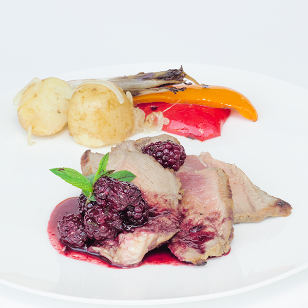 Marinated and grilled lamb with blackberries relish, grilled vegetables and papillote potatoes